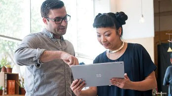 Men and women using windows tablet